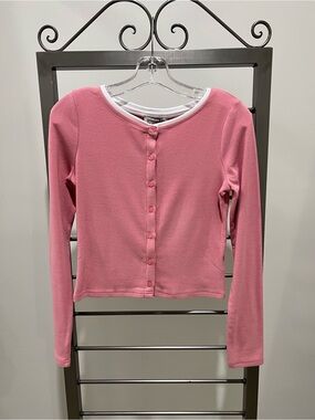 Pretty Garbage pink ribbed cardigan with white trim!